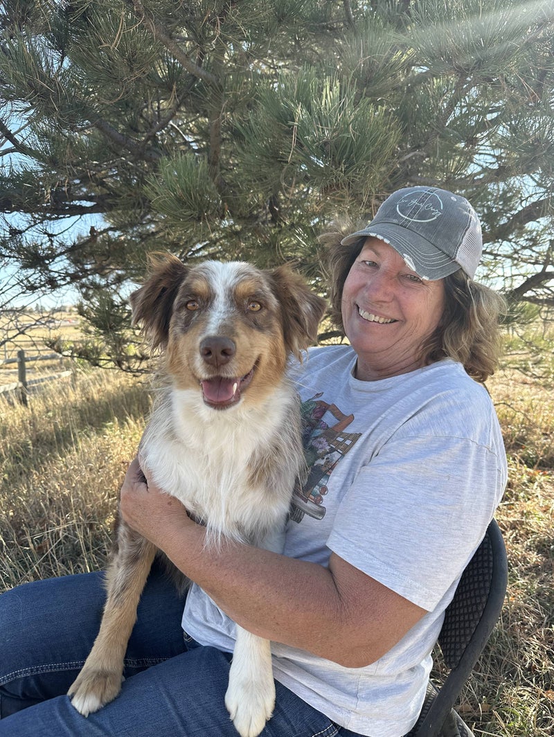 Holly, mentor at Legacy Ranch, with Golden Retrievers