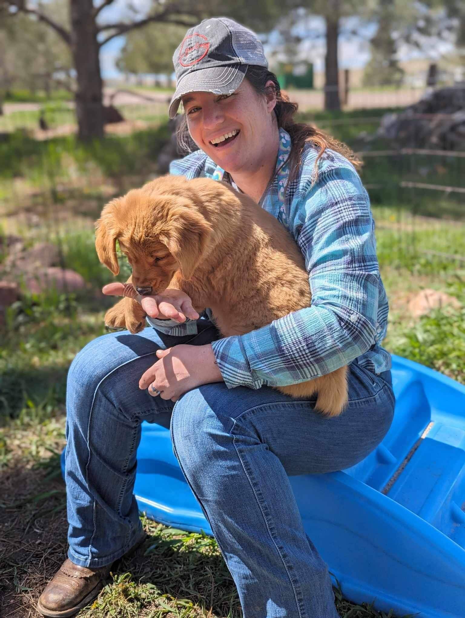 Lindsey, Navy veteran and Golden Retriever breeder, with her dogs in Parker, Colorado